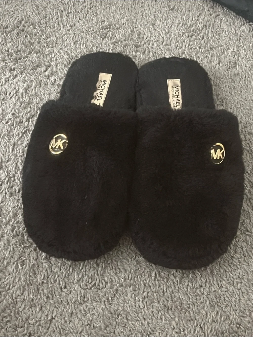 Michael Kors Black Faux-Fur Slip-Ons with Gold MK Emblem